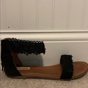 Black and lace sandals.